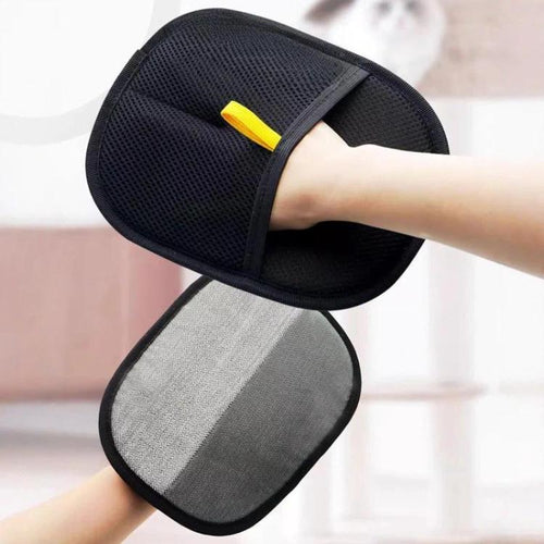 Black electrostatic pet hair remover glove shown in use