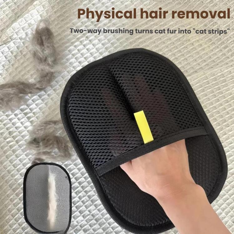 Reusable black grooming glove collecting loose pet fur